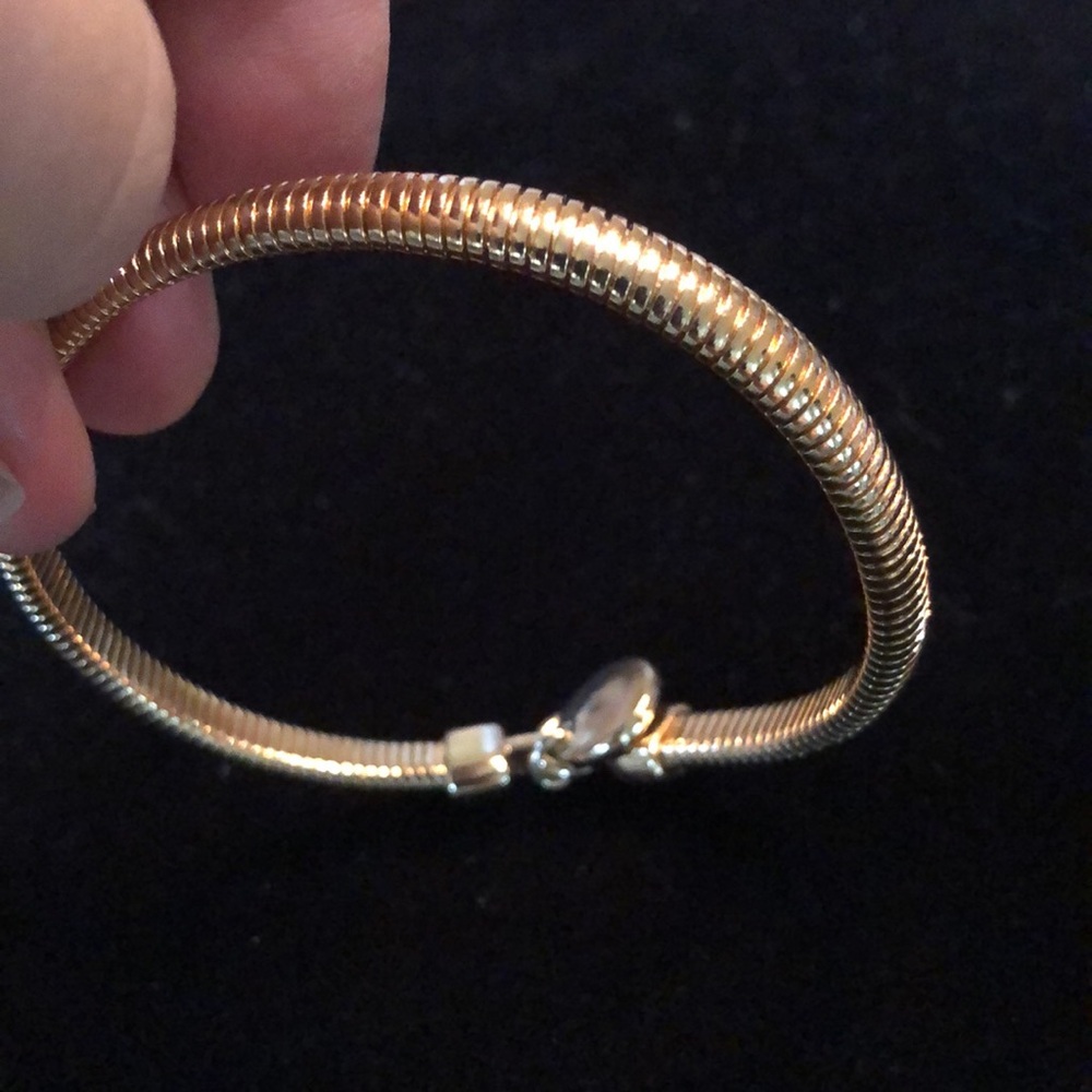 Anne Klein vintage gold tone omega stretchy pull on single logo charm bracelet